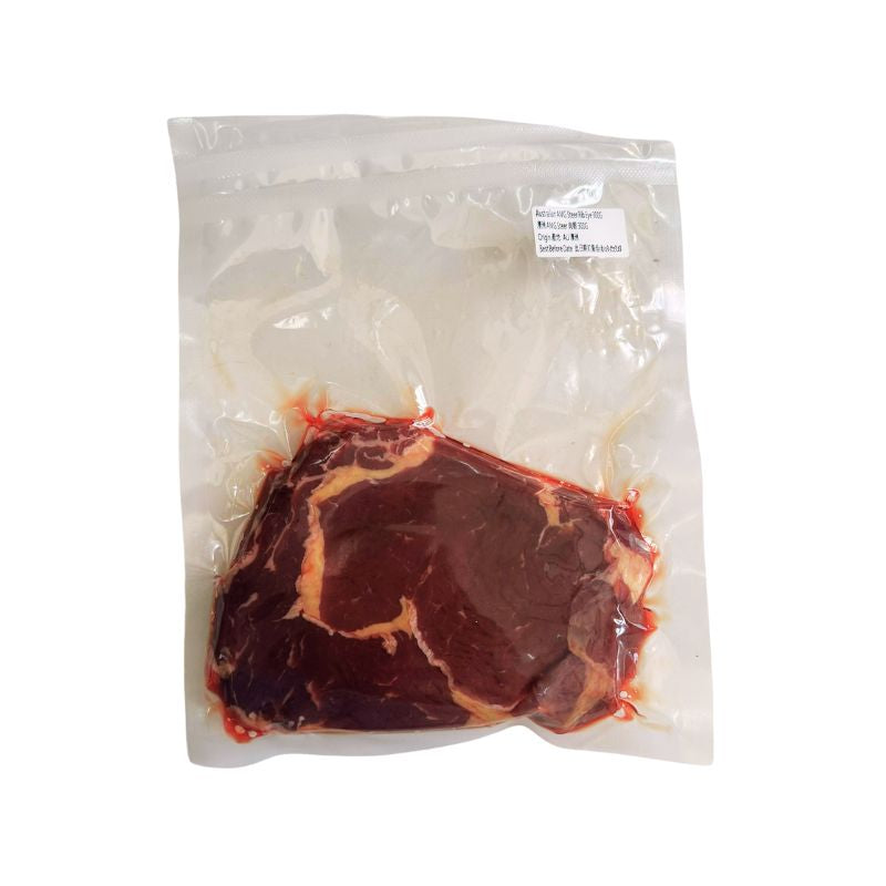 Vacuum-sealed package of Australian AMG Grass Fed  Steer Ribeye on a white background