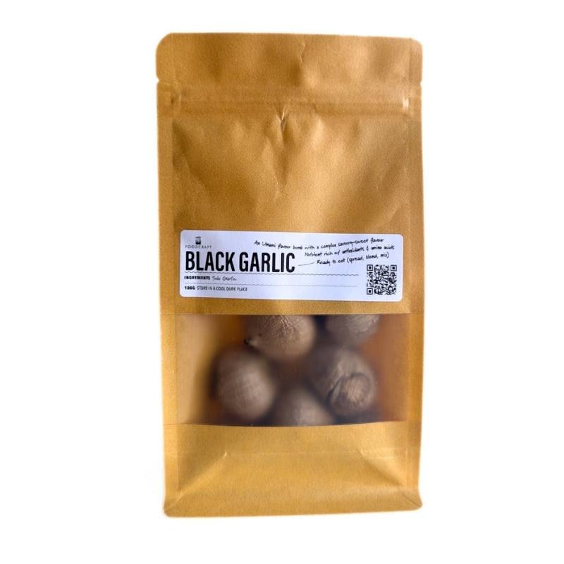 Brown package of Black garlic - 100g  with a clear window on a white background
Foodcraft Online Store