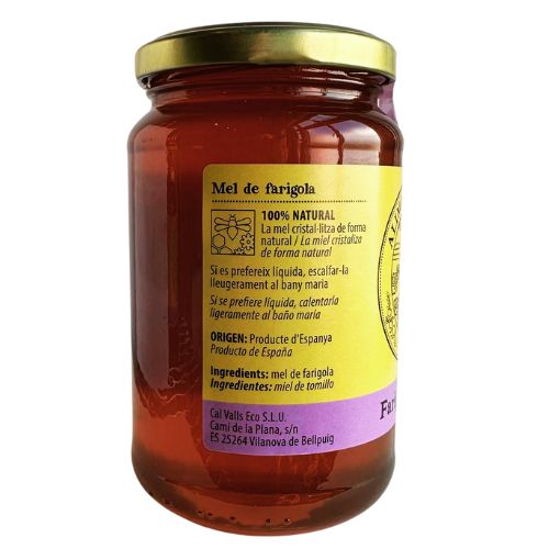 Jar of Cal Valls Thyme Honey with a gold lid and visible label on a white background