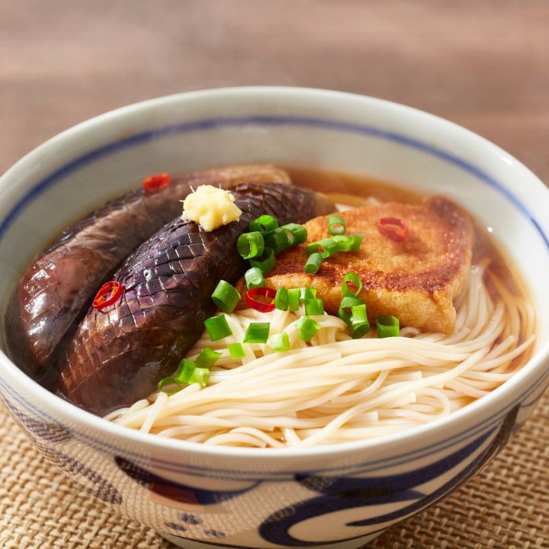 Bowl of noodles with mushrooms and green onions in a Dashi Broth