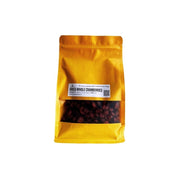 Yellow package of dried whole cranberries on a white background