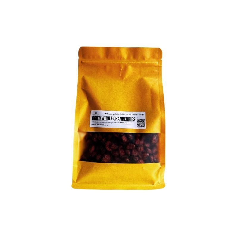 Yellow package of dried whole cranberries on a white background