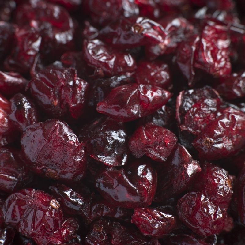 Close-up of Dried Whole Cranberries with a dark background