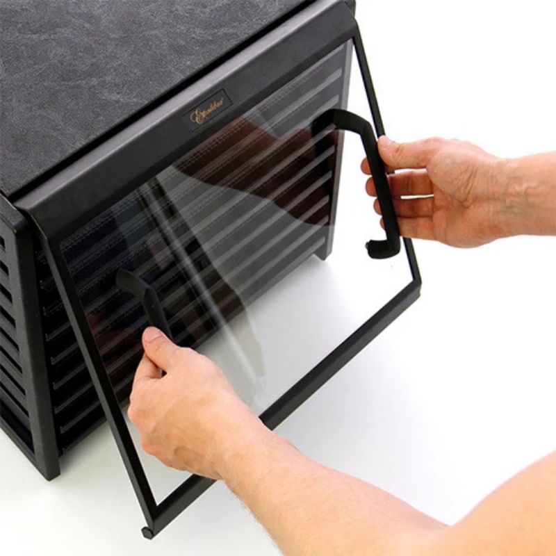 Person opening a Excalibur Clear Door for 9-Tray