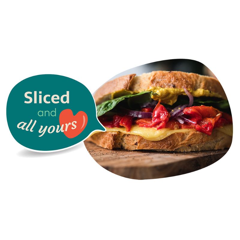 Sandwich with GREEN VIE Vegan Cheddar Flavour Slices  and vegetables on a wooden board with 'Sliced and all yours' text.