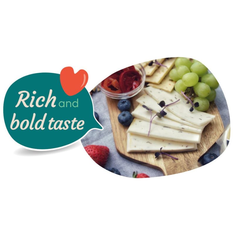 Platter of GREEN VIE Vegan Cheese with fruits and a speech bubble with 'Rich and bold taste' text.
