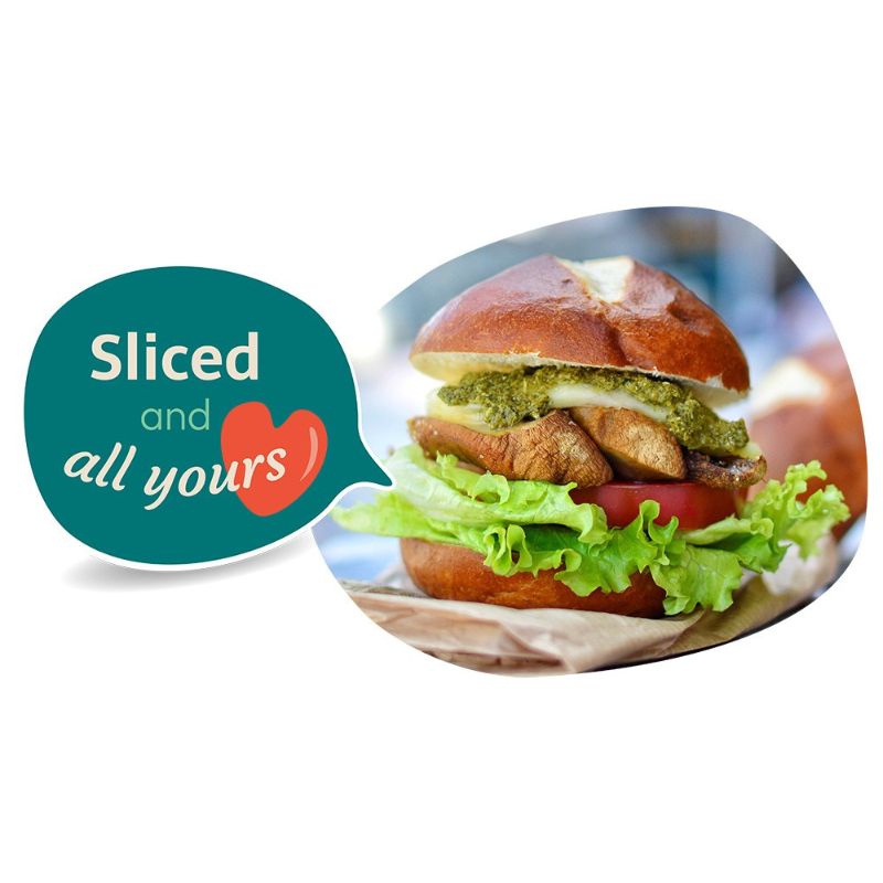 Hamburger on a plate with GREEN VIE Vegan Mozzarella Flavour slices and a speech bubble saying 'Sliced and all yours' on a white background