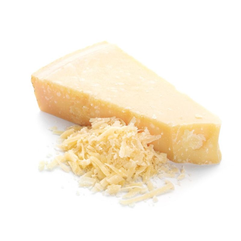 Block of GREEN VIE Vegan Parveggio with a pile of grated cheese on a white background