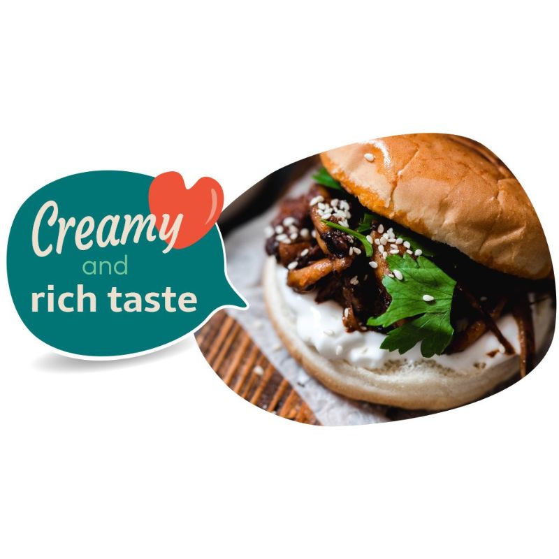 Burger with GREEN VIE Vegan Sour Cream and text 'Creamy and rich taste' on a white background