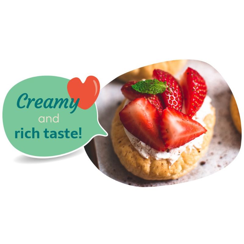 Dessert with strawberries and GREEN VIE Vegan Spread me Original, accompanied by a speech bubble with 'Creamy and rich taste!' text.