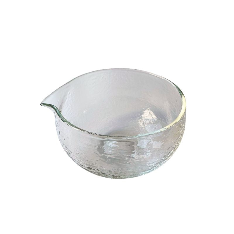 Clear glass bowl with a spout on a white background