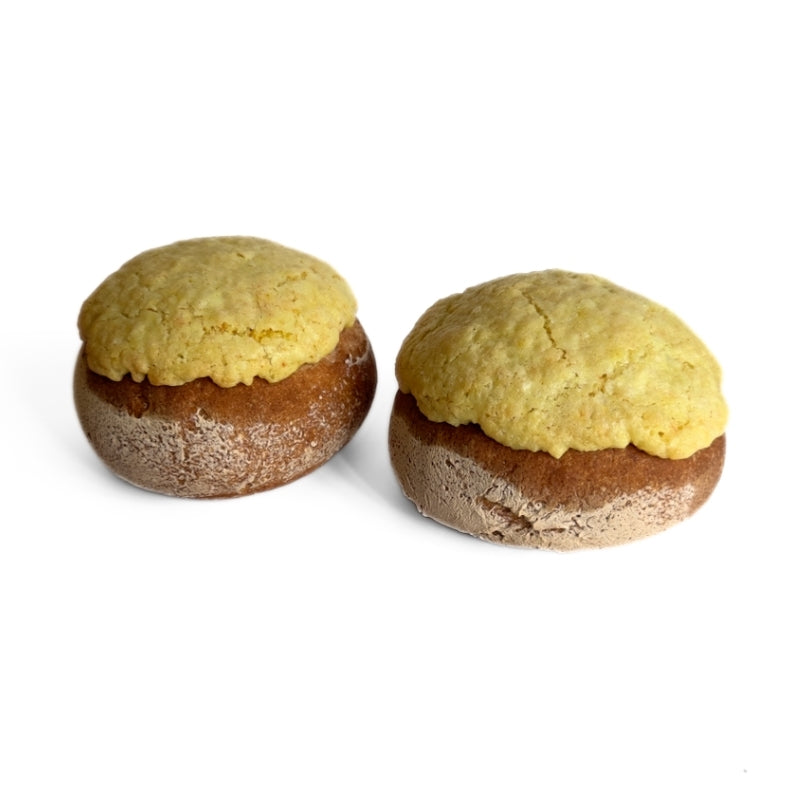 Two Gluten Free Vegan Sourdough Pineapple Buns on a white background