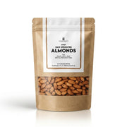 A stand-up kraft paper pouch of Foodcraft Raw Sprouted Almonds, featuring a clear window at the bottom showing the almonds inside, set against a clean white background.