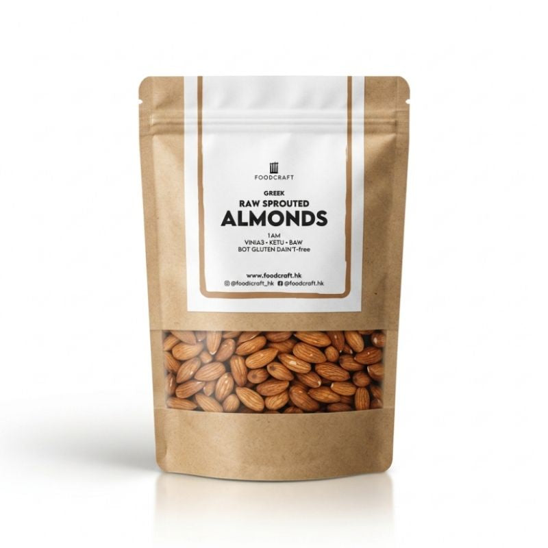 A stand-up kraft paper pouch of Foodcraft Raw Sprouted Almonds, featuring a clear window at the bottom showing the almonds inside, set against a clean white background.