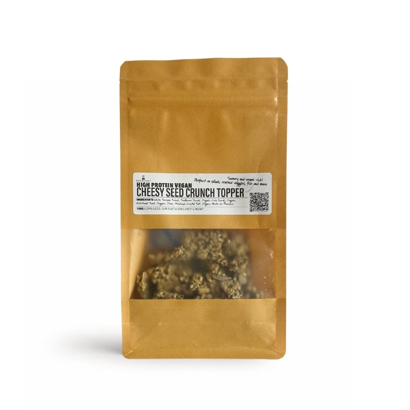 A stand-up kraft paper pouch  High Protein Vegan Cheesy Seed Crunch Topper - 100g (Foodcraft Online Store) The pouch is centered on a clean white background with a soft shadow.