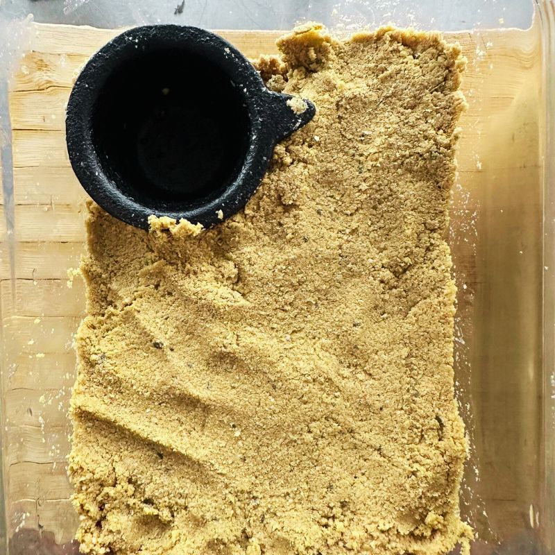 nukadoko on a cutting board with Ikenaga Iron Works Nanbu Ironware Water Drainer & Iron Supplement for Nukazuke - Mini