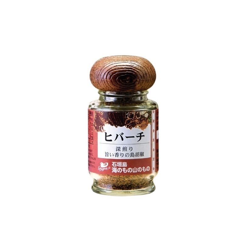 A small glass jar of Japanese MSG-Free Hibachi Pepper Seasoning with a dark brown wooden cap, featuring a red and white label with Japanese text.