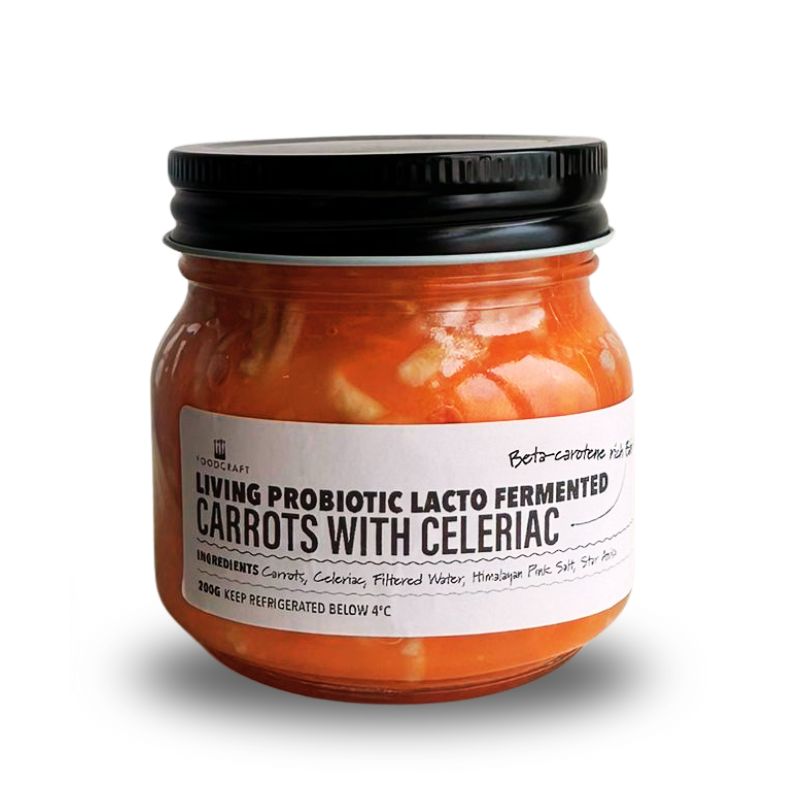 Jar of Living Lacto-Fermented Carrots with Celeriac on a white background