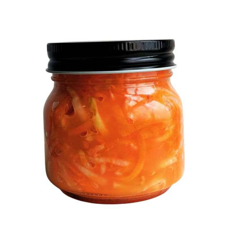 Jar of Living Lacto-Fermented Carrots with Celeriac on a white background