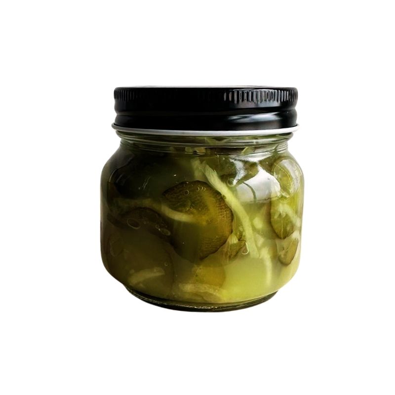 Jar of Living Lacto-Fermented Cucumber with Ginger - 200g with a black lid on a white background