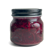 Jar of Living Lacto-Fermented Beetroot on a white background