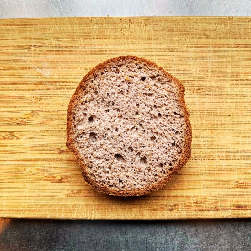 Slice of Low Carb Keto Buns on a wooden cutting board
