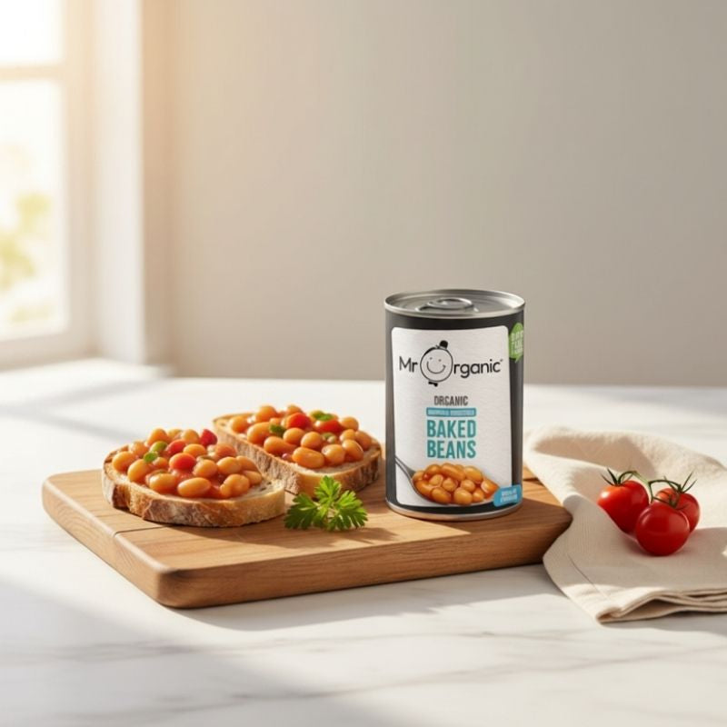 Mr Organic Naturally Sweetened Baked Beans 400g displayed with baked beans on toast in a bright kitchen. Organic, naturally sweetened, high-protein baked beans available for delivery across Hong Kong.
