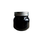 Raw Black Sesame Butter - 250g jar with a silver lid on a white background