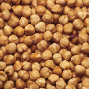 A close-up, top-down view of Raw Sprouted Hazelnuts - 400g filling the entire frame.
