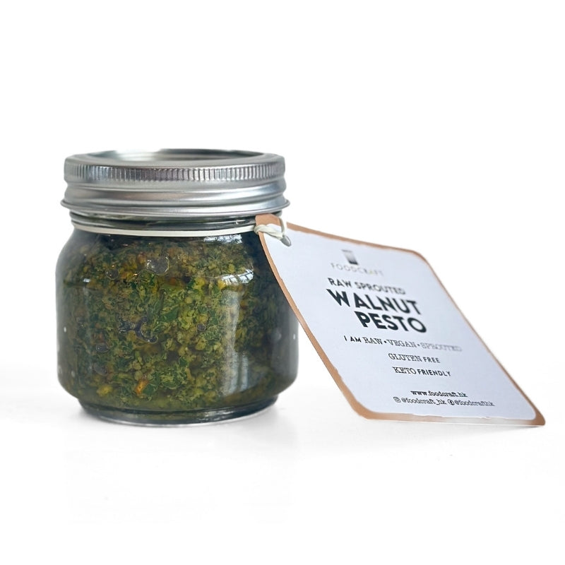 Jar of Raw Sprouted Walnut Pesto with a label on a white background