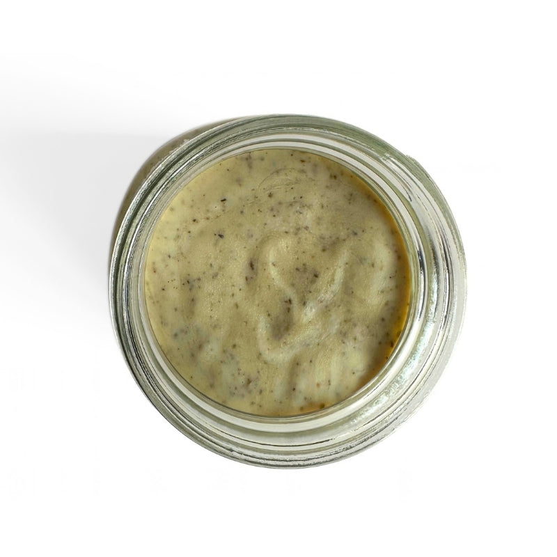 Top-down view of a clear glass jar filled with Raw Vegan Butter with Herbs- 180g set against a plain white background.

Foodcraft Online Store 