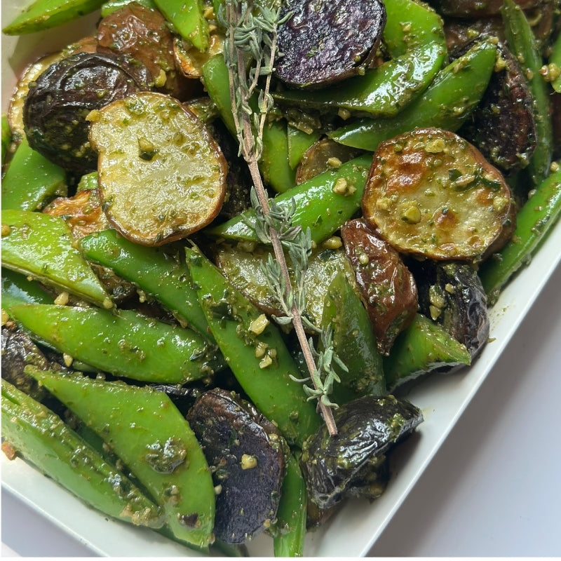 A close up view of a white cardboard food tray filled with Roasted Potato Salad with Sprouted Walnut Pesto -  (600g | Serves 3 – 6 people) on a white background.

Foodcraft Online Store