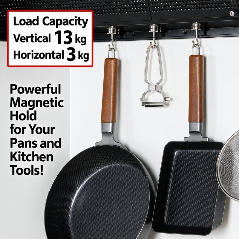 Shimomura Kihan Heavy Duty Neodymium Magnetic Hooks - Set of 5 (model number 44638) hanging cookware and utensils, including a frying pan, a square pan, a peeler, and a strainer, shown against a white wall with text highlighting load capacity and powerful magnetic hold.