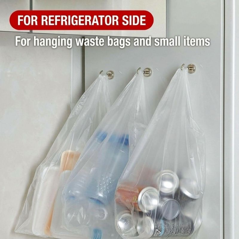 Three clear plastic bags hanging from Shimomura Kihan Heavy Duty Neodymium Magnetic Hooks - Set of 5 (model number 44638) attached to a refrigerator door, with text at the top reading 'FOR REFRIGERATOR SIDE' and 'For hanging waste bags and small items.' The bags are shown holding assorted household items.