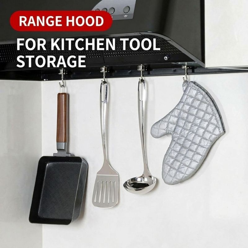 Shimomura Kihan Heavy Duty Neodymium Magnetic Hooks - Set of 5 (model number 44638) mounted under a range hood, holding a black frying pan, a metal spatula, a metal ladle, and a silver quilted oven mitt. White text on a red badge at the top reads 'RANGE HOOD' and 'FOR KITCHEN TOOL STORAGE'.