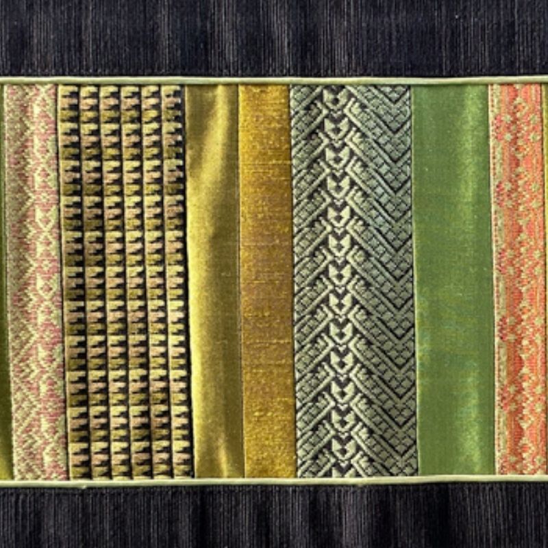 a close-up shot of Sop Moet Arts Handmade Silk Table Runners - 49cm x 22cm Black x Green