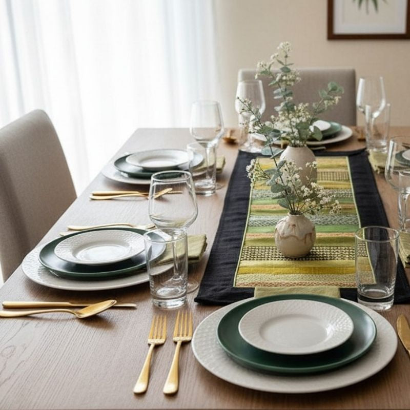 Dining table set with plates, glasses, and a vase with flowers in a home setting with Sop Moet Arts Handmade Silk Table Runners - 49cm x 22cm Black x Green