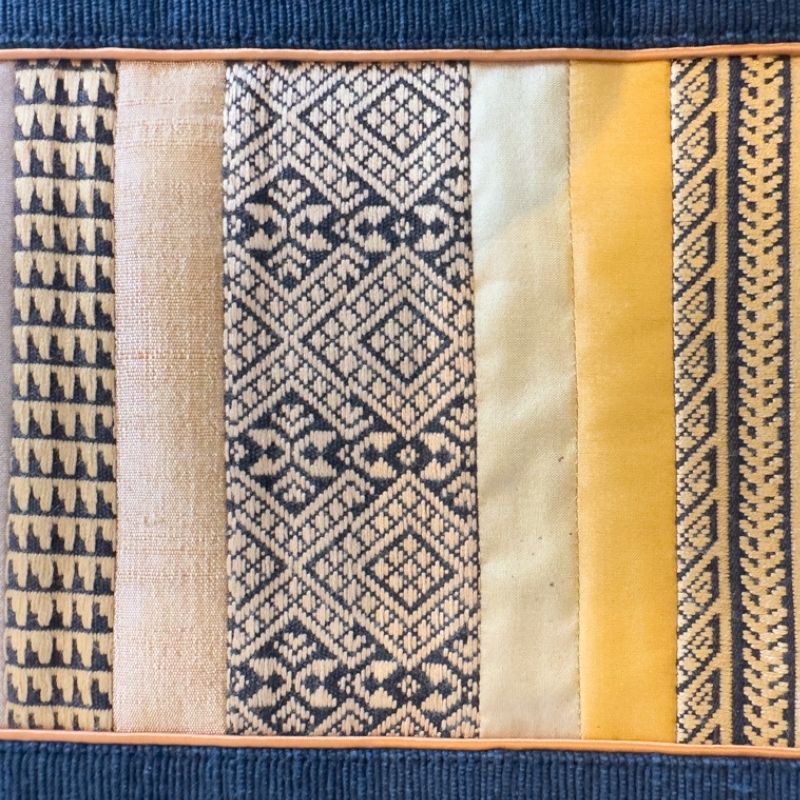 a close-up shot of Sop Moet Arts Handmade Silk Table Runners - 49cm x 22cm Navy x Gold