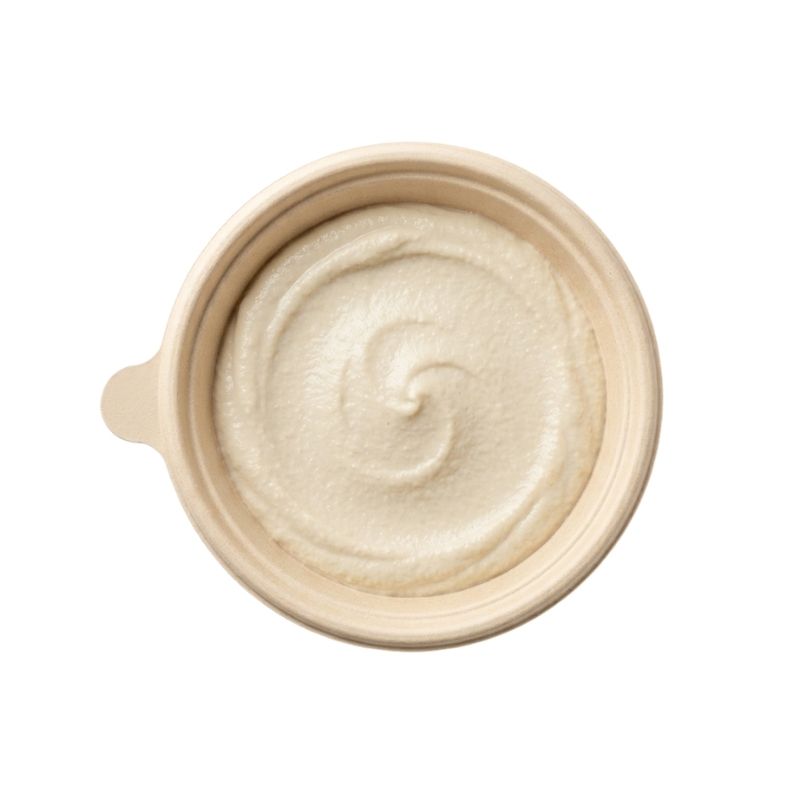 A top-down view of Sprouted Cashew Sour Cream - 180g, set against a solid white background.