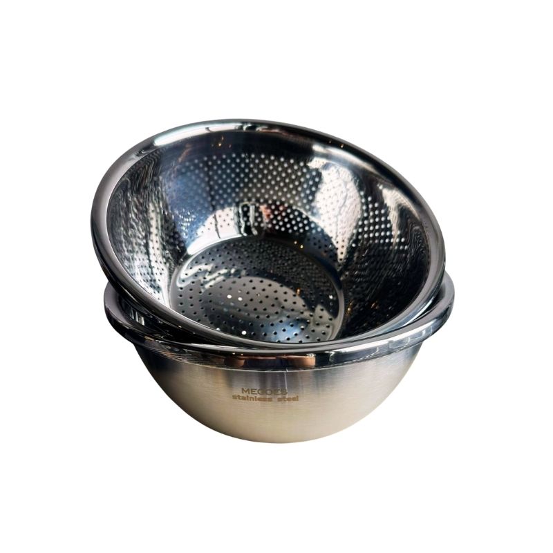 Stainless steel colander on a white background