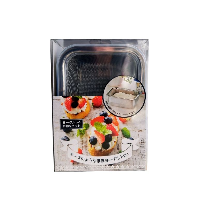 A packaged Stainless Steel Greek Yogurt Strainer 希臘優格水濾器 shown in its retail box on a plain white background. The front of the packaging features a photo of fruit-topped pastries and a circular inset demonstrating the loaf pan in use.