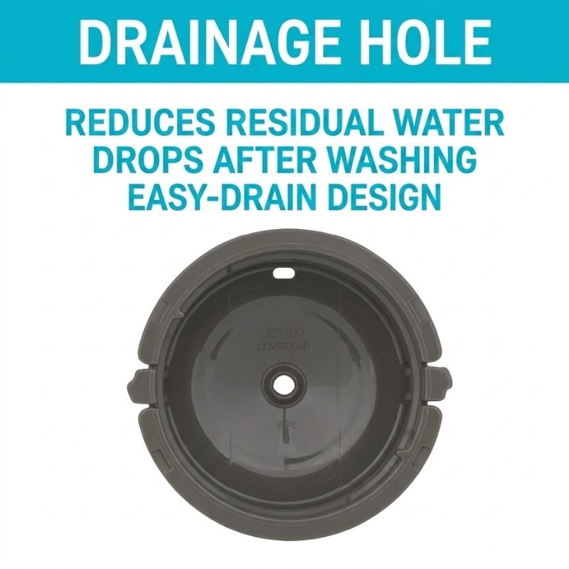 A dark gray THERMOS Vacuum Insulated Food Jar - 500ml inner lid with a central drain opening, shown below bold text that reads 'DRAINAGE HOLE' and 'REDUCES RESIDUAL WATER DROPS AFTER WASHING / EASY-DRAIN DESIGN' on a white background.