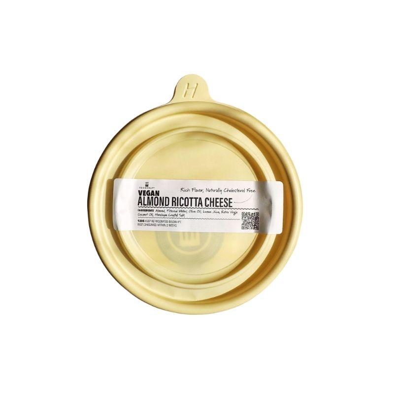 Foodcraft Vegan Almond Ricotta Cheese container with a beige lid on a white background