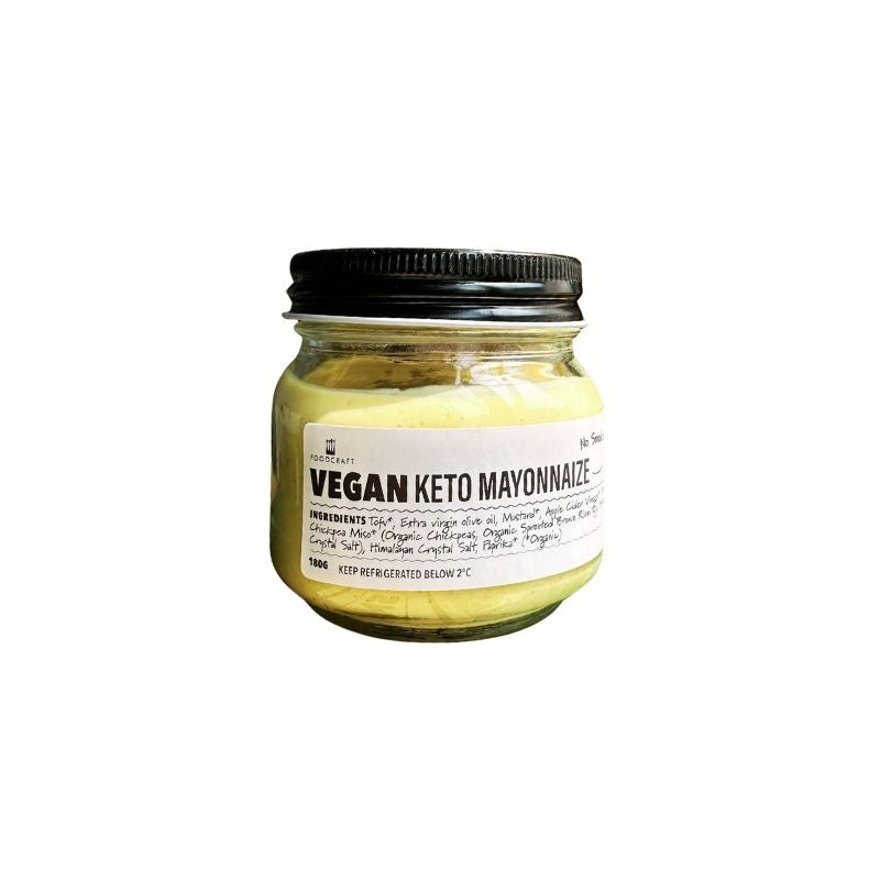 A glass jar of Vegan Keto Mayonnaise with a black lid and a white label, set against a plain white background.