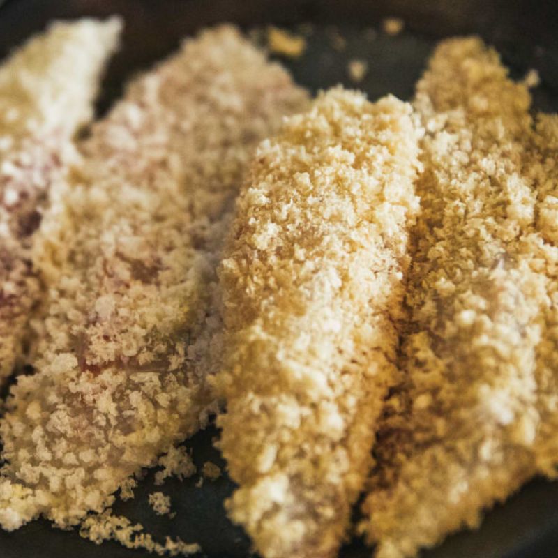 Wa Panko Gluten-Free Rice Panko Breadcrumbs Breaded chicken pieces in a frying pan