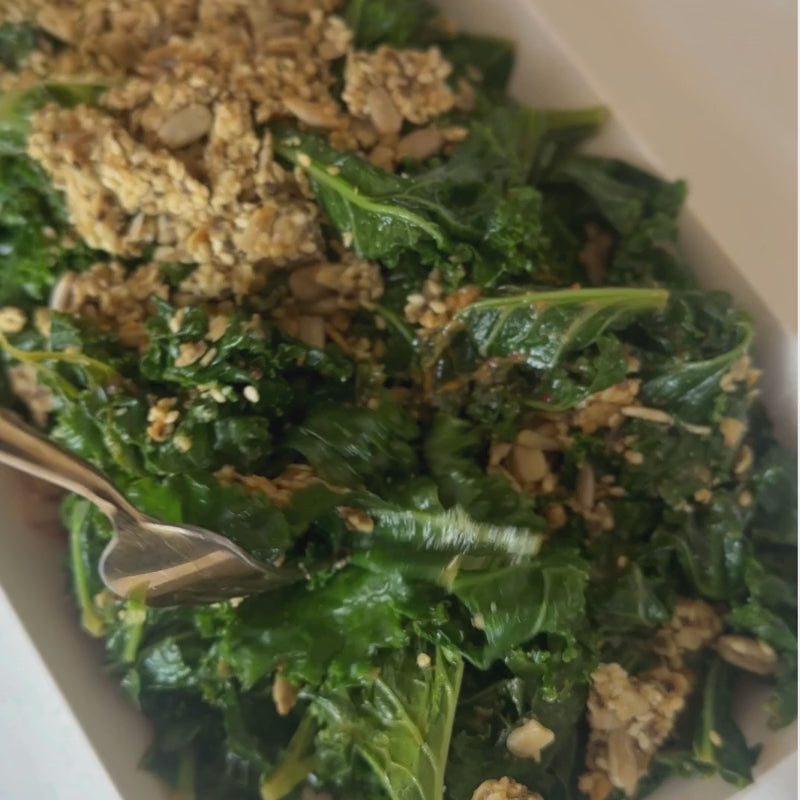 A close up of Kale Salad with Chilli Miso Dressing and Vegan Cheesy Seed Crunch Topper - (400g | Serves 4 – 6 people)