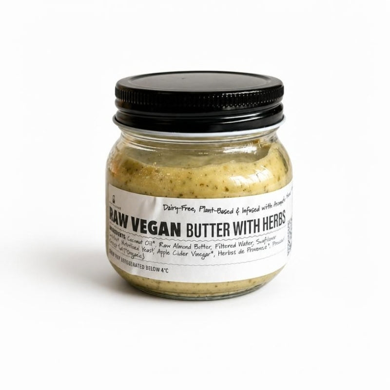 A small clear glass jar Raw Vegan Butter with Herbs- 180g  featuring a black metal screw lid and a white label with black text, set against a plain white background.

Foodcraft Online Store